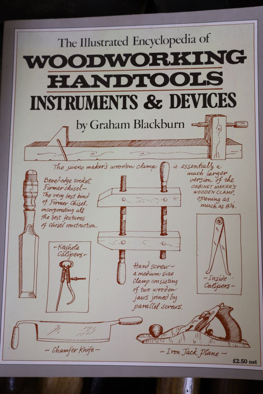 Mixed hand tools including a hatchet, together with the illustrated Encyclopedia of Woodworking Hand Tools and Devices by Graham Blackb